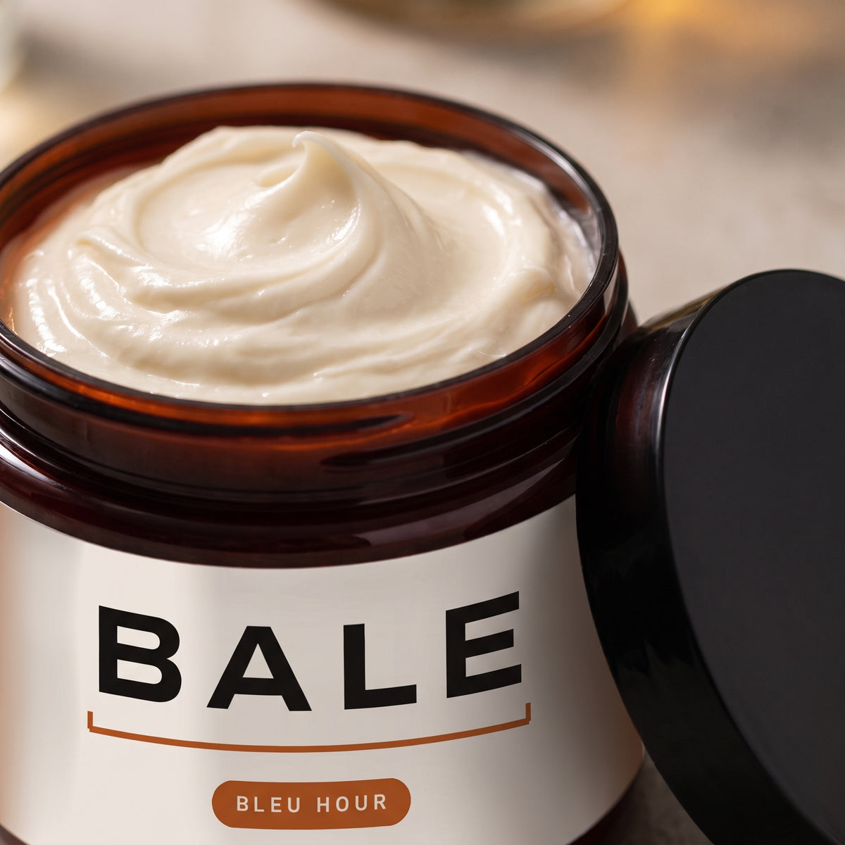 Close-up of whipped Bleu Hour body butter in the open jar