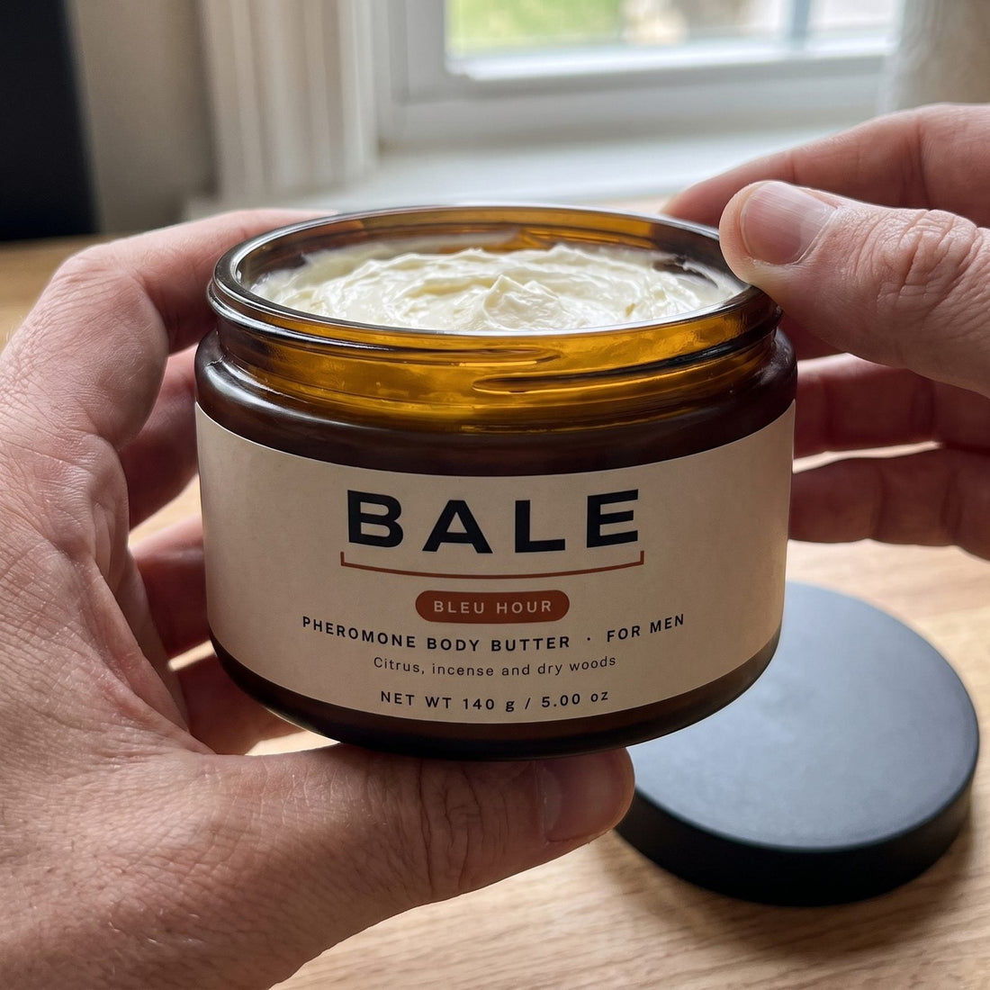 Close-up of whipped Bale Bleu Hour body butter in the open jar