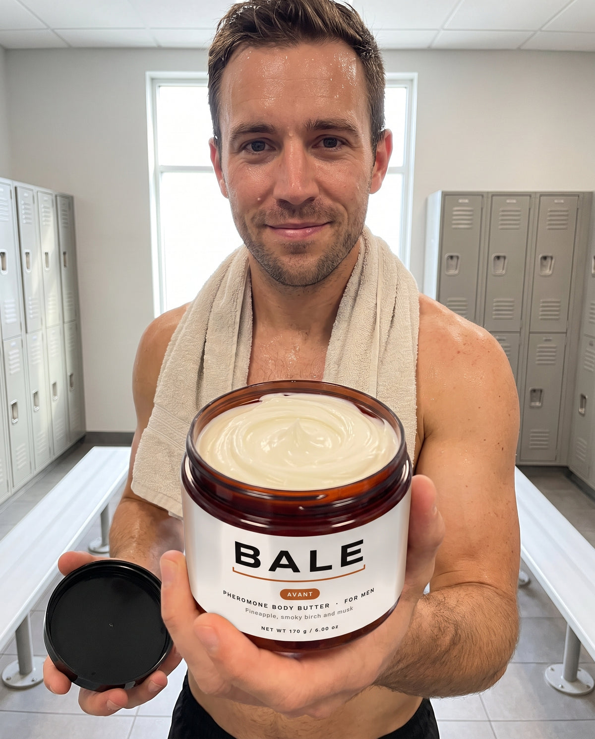 Man after the gym holding an open jar of Avant body butter