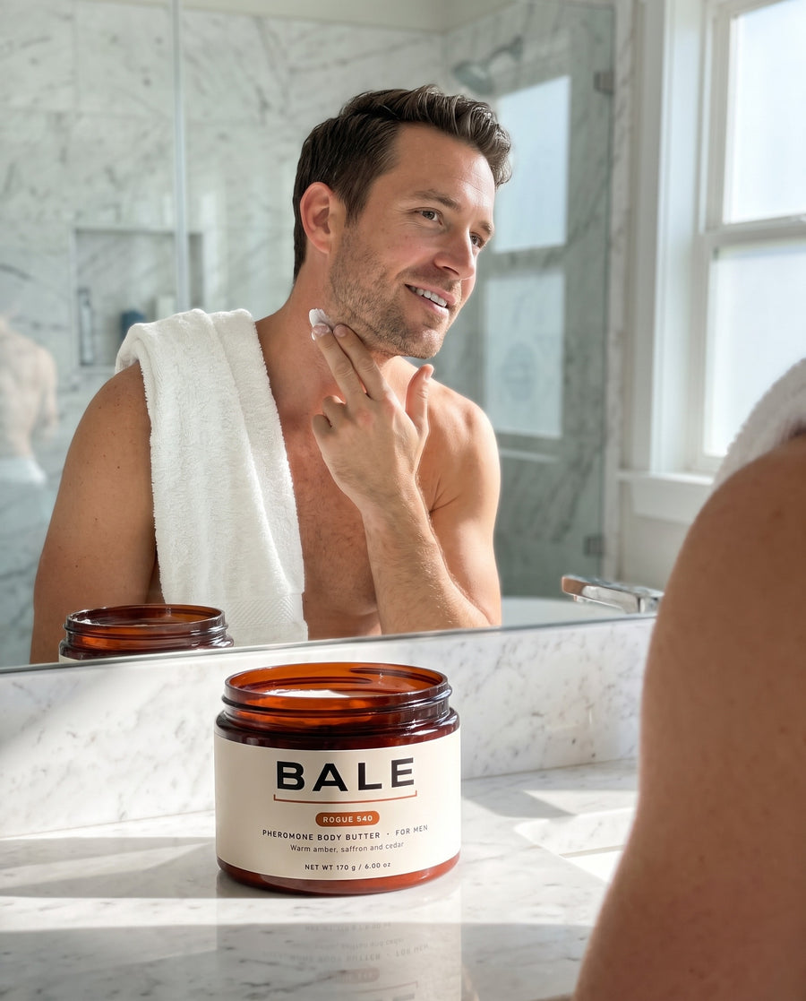 Man pressing Rogue 540 body butter into his neck before a date, open jar on the counter